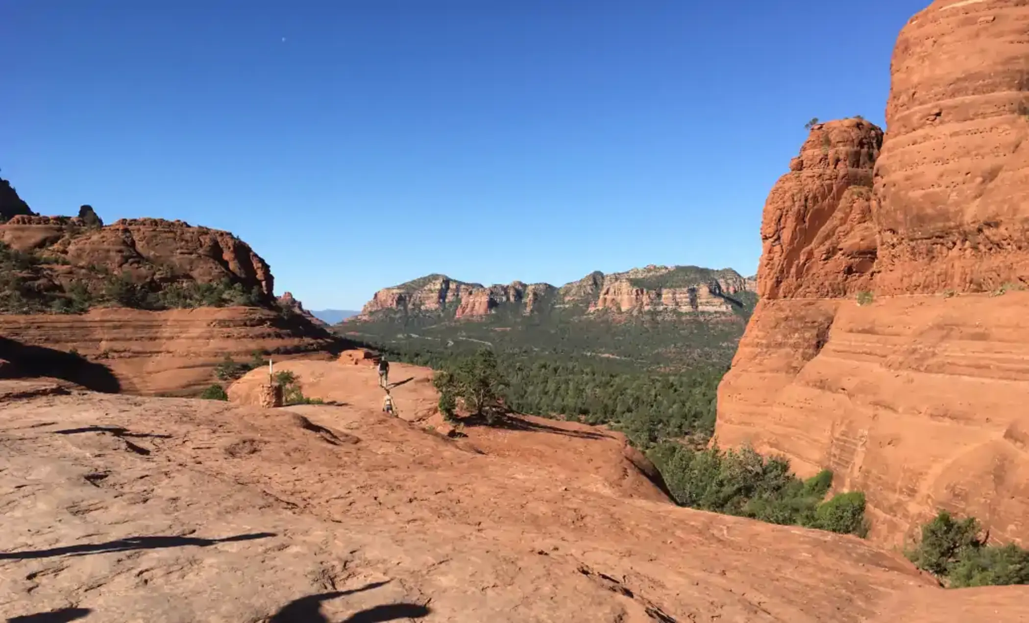 Hiking on the rocks in Sedona. Expansive rust colored mountain landscape in Sedona, Arizona