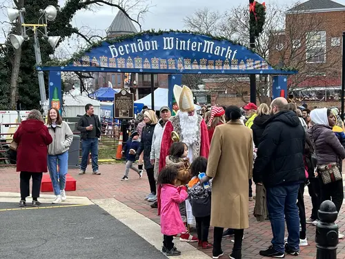St Nicholas greets family, Herndon WinterMarkt, Virginia