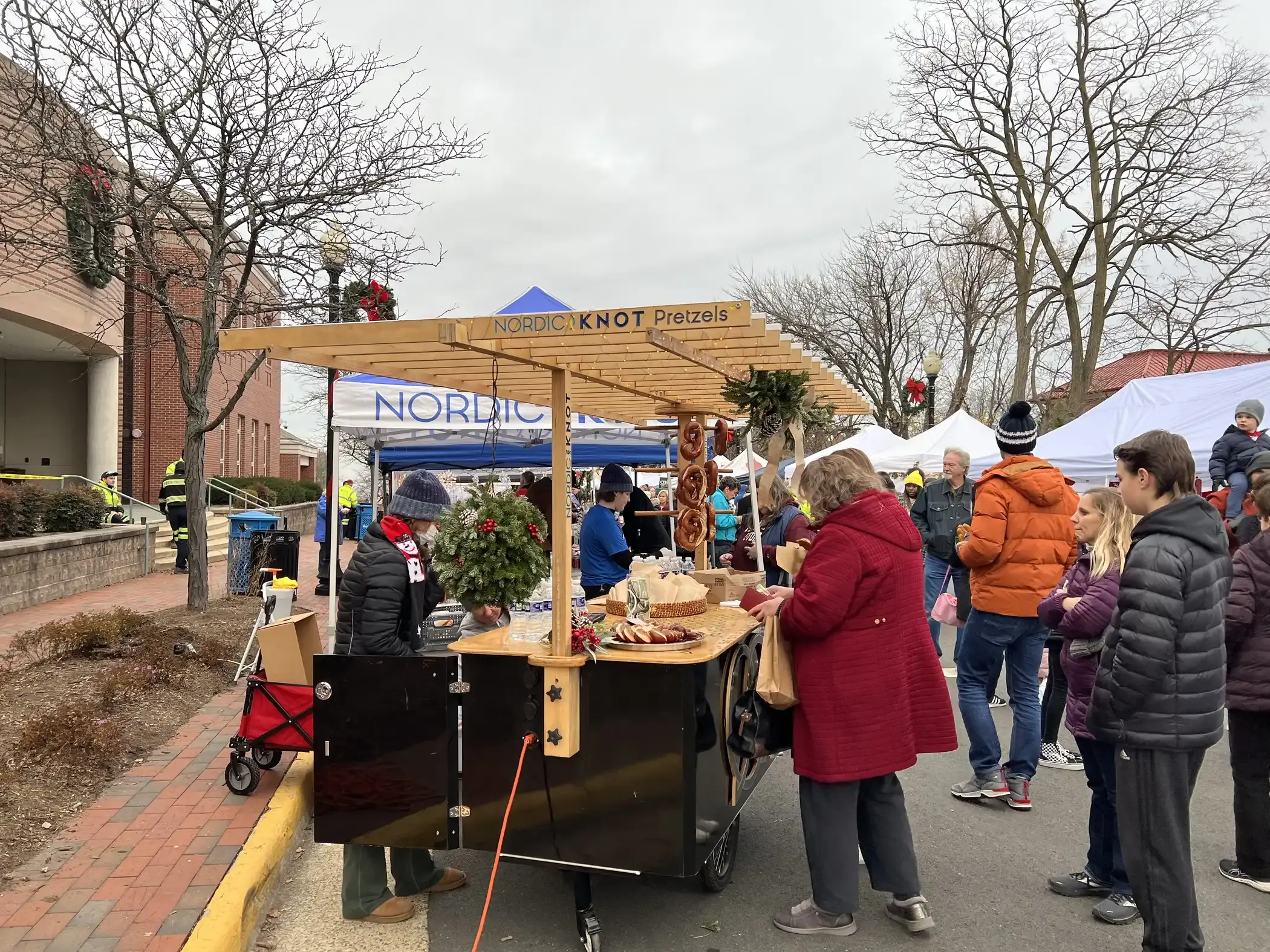 Patrons enjoy Nordic Knot pretzels at Herndon Winter Markt